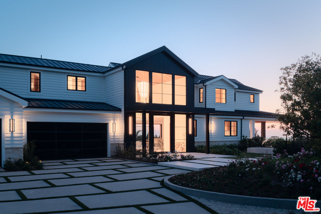 5819 Filaree Heights Road Malibu, CA 90265 - Photo 5 of 41 a front view of a house with yard and parking