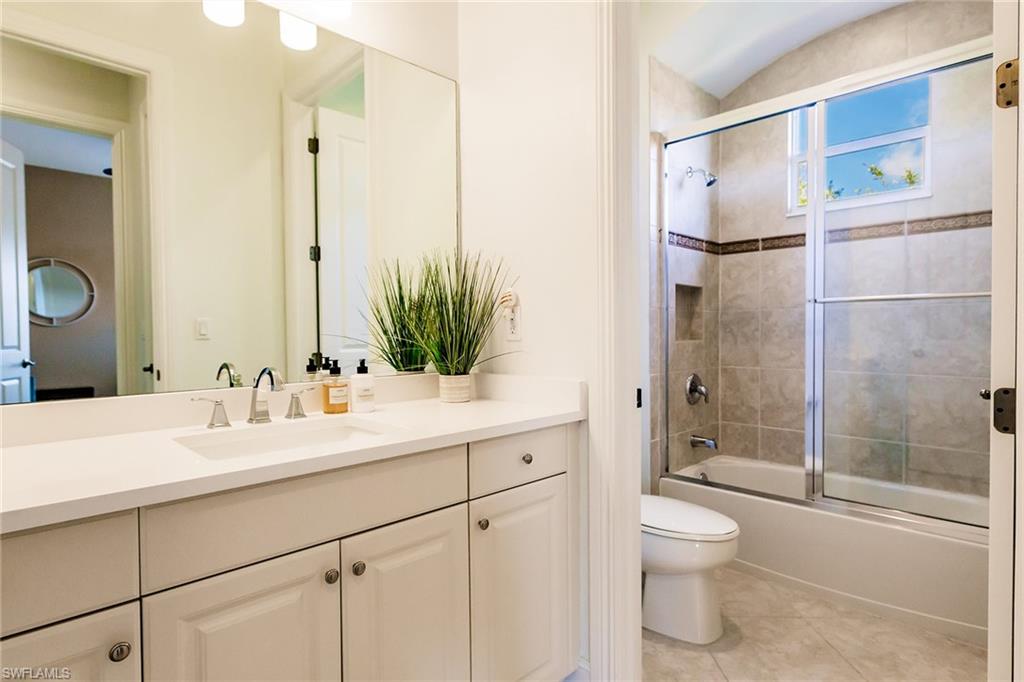 7797 Ashton Road Naples, FL 34113 - Photo 27 of 50 a bathroom with a sink toilet and shower