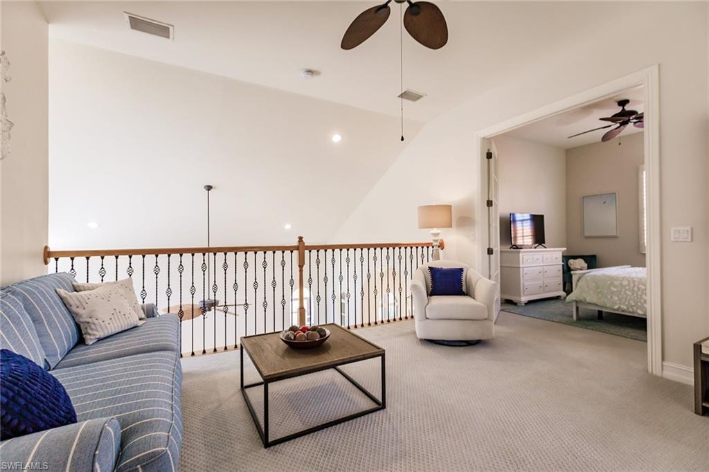 7797 Ashton Road Naples, FL 34113 - Photo 31 of 50 a living room with furniture and a large window
