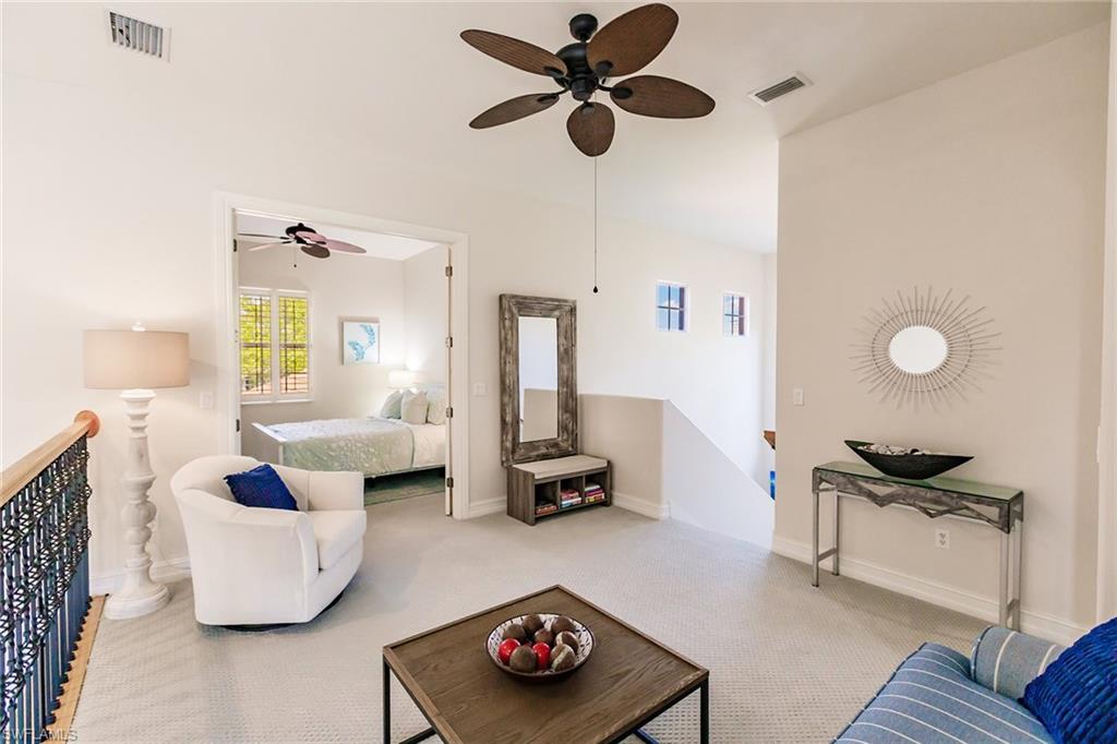 7797 Ashton Road Naples, FL 34113 - Photo 33 of 50 a living room with furniture and a window