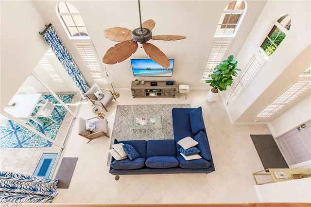 a view of living room with furniture and a chandelier