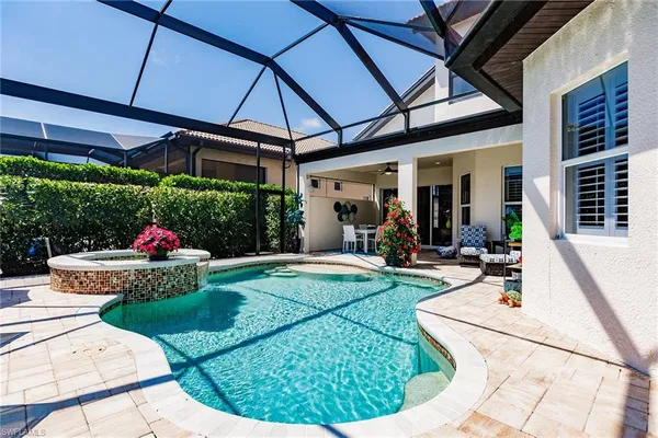 a view of a swimming pool with a porch in front of it