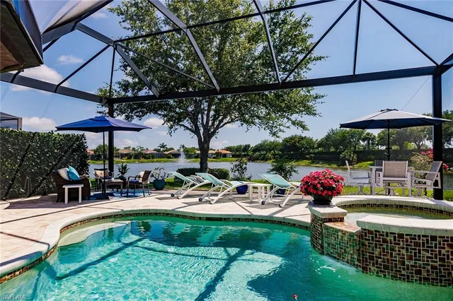 a view of a swimming pool with a patio