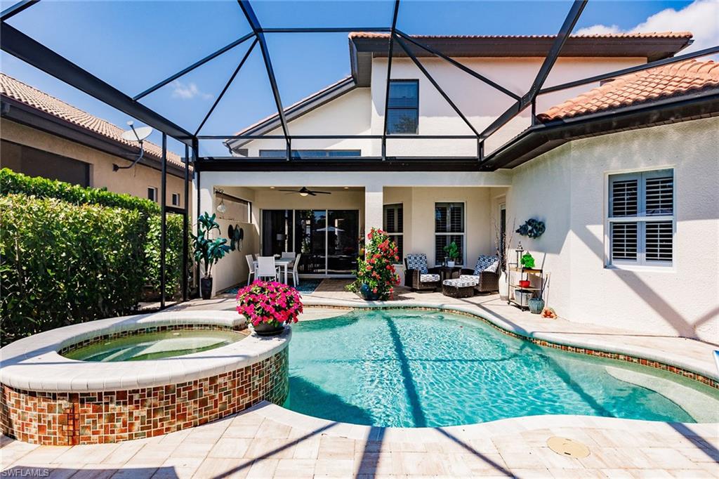 7797 Ashton Road Naples, FL 34113 - Photo 49 of 50 a view of outdoor space yard deck patio and swimming pool