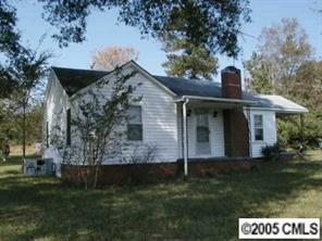 4502 Richardson Road Monroe, NC 28112 - Photo 3 of 7 a front view of a house with a garden