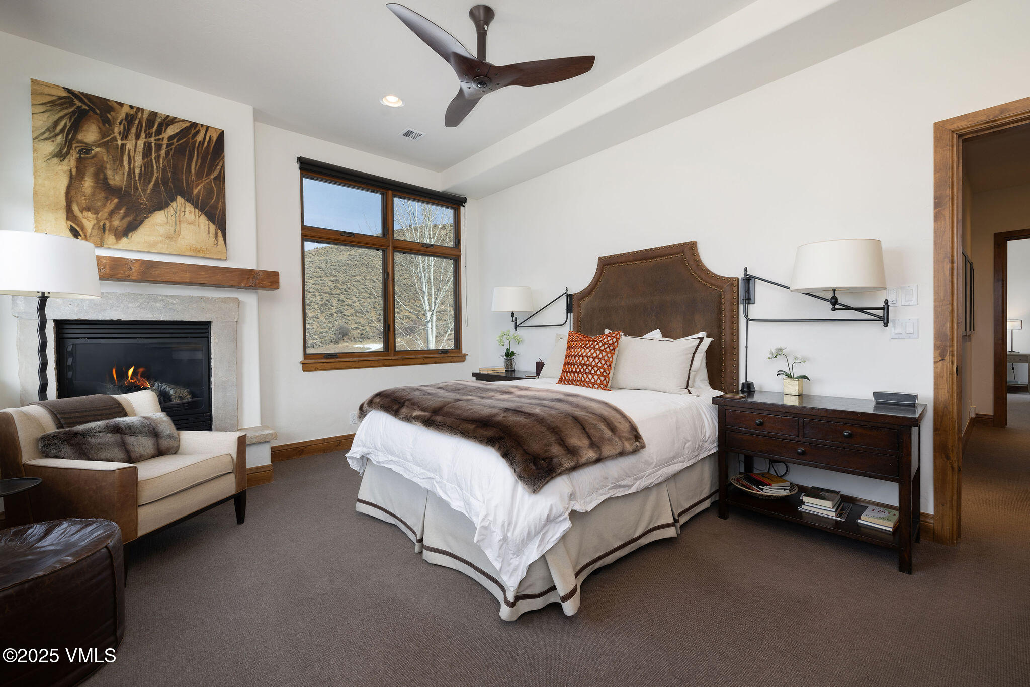 751 Singletree Road, Unit 28 Edwards, CO 81632 - Photo 8 of 20 a spacious bedroom with a bed a couch and a painting on the wall