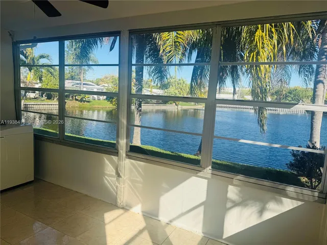 a bathroom with a granite countertop shower and a sink