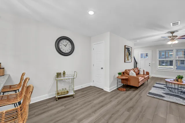 a view of a livingroom with furniture and a chair