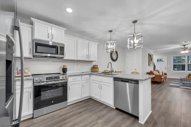 a kitchen with a stove and a sink