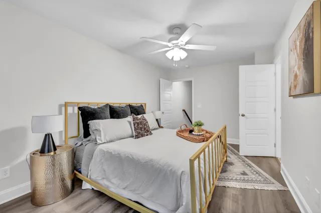 a bedroom with two beds and a chandelier