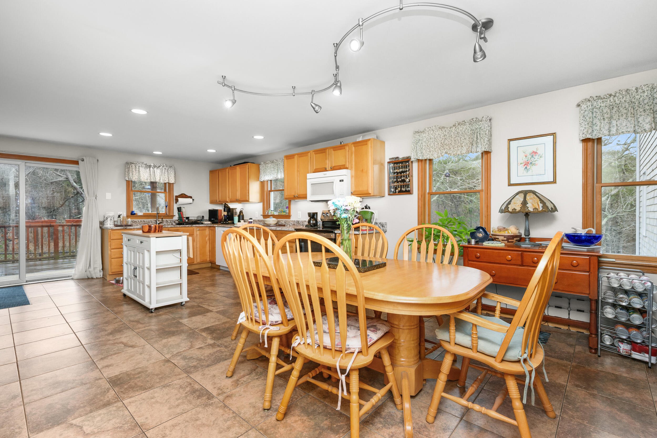 2 Short Lots Lane Truro, MA 02666 - Photo 14 of 66 a dining room with stainless steel appliances kitchen island granite countertop a dining table chairs and granite counter tops