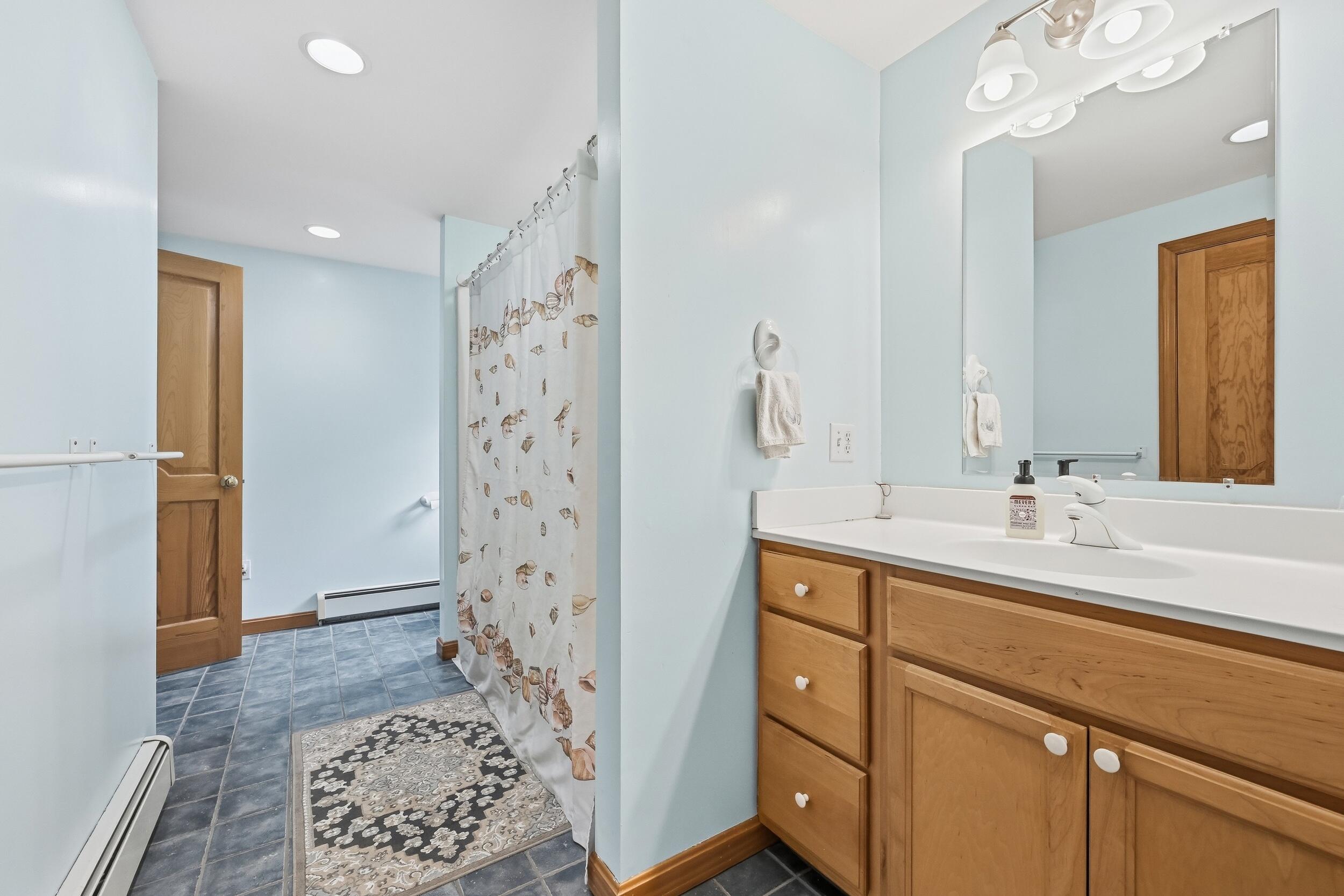 2 Short Lots Lane Truro, MA 02666 - Photo 21 of 66 a bathroom with a sink a toilet and shower