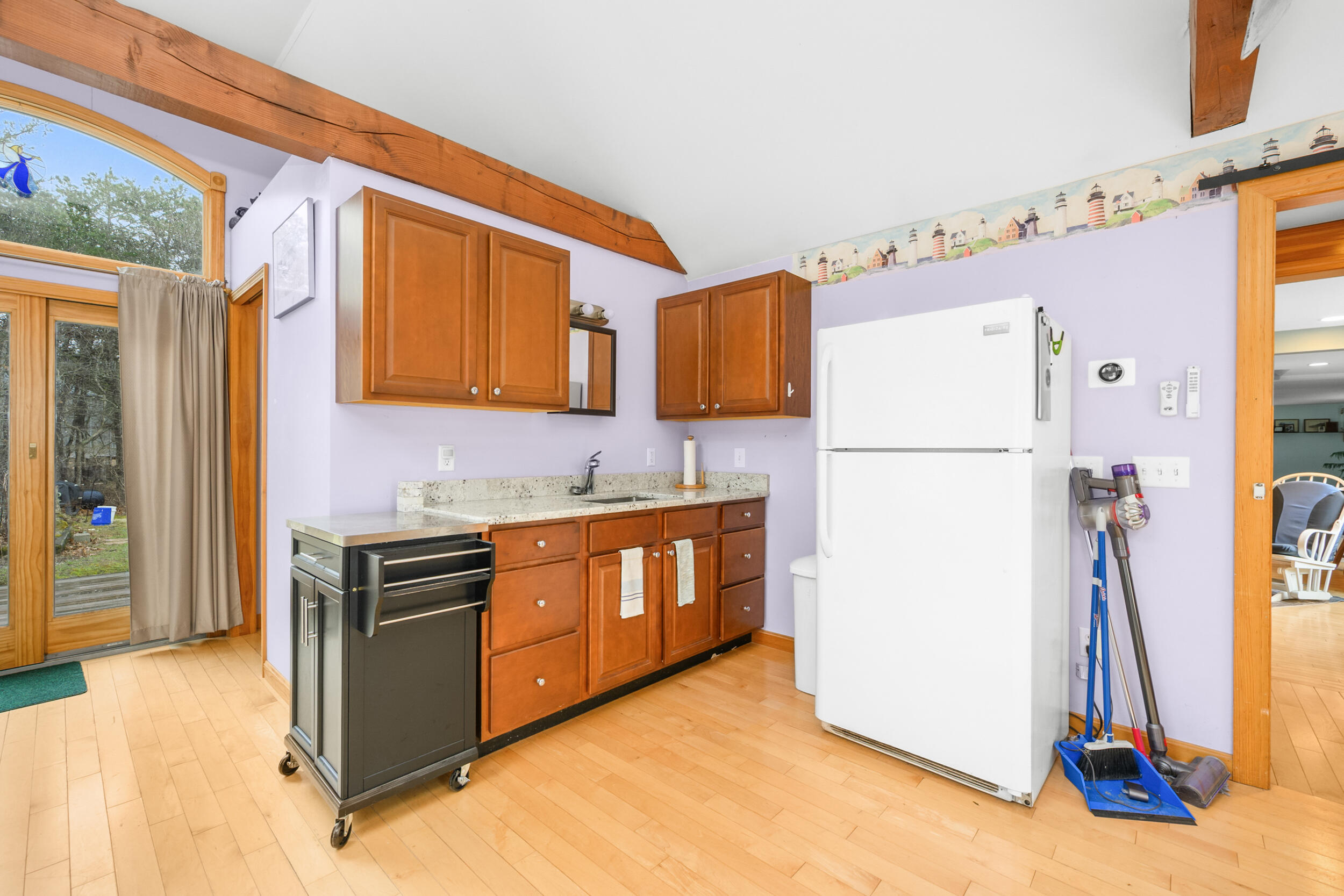 2 Short Lots Lane Truro, MA 02666 - Photo 23 of 66 a kitchen with refrigerator and cabinets