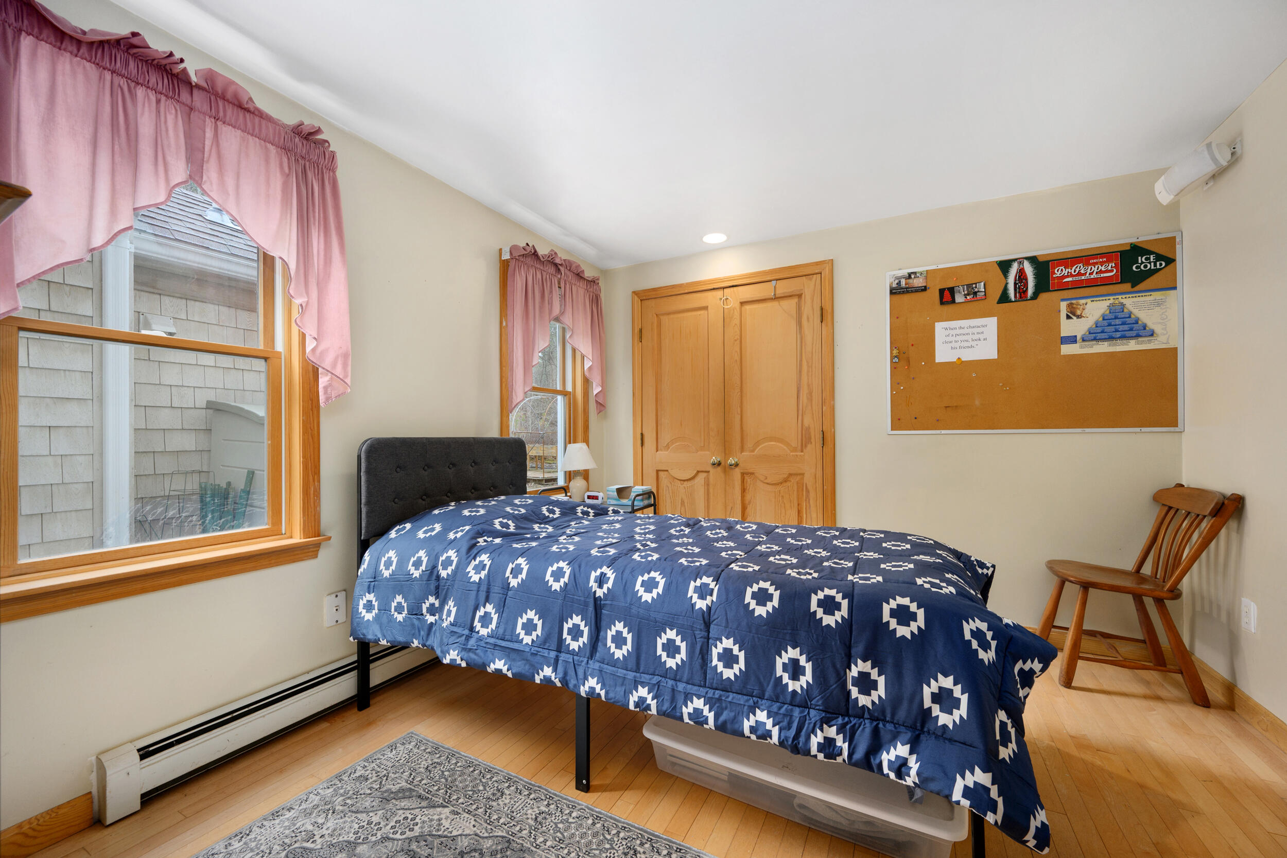 2 Short Lots Lane Truro, MA 02666 - Photo 28 of 66 a bedroom with a bed and wooden floor