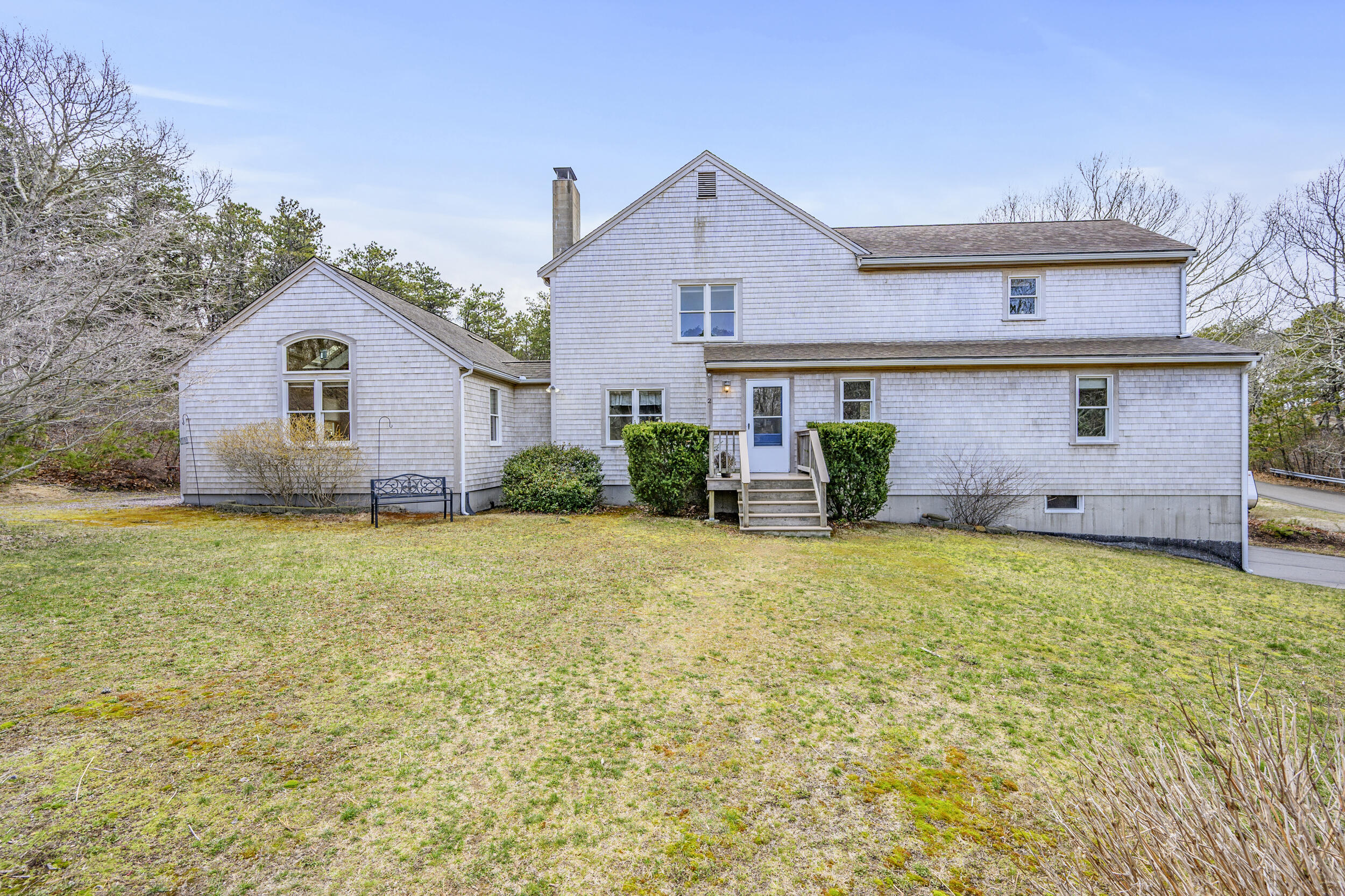 2 Short Lots Lane Truro, MA 02666 - Photo 38 of 66 a front view of house with yard and trees in the background