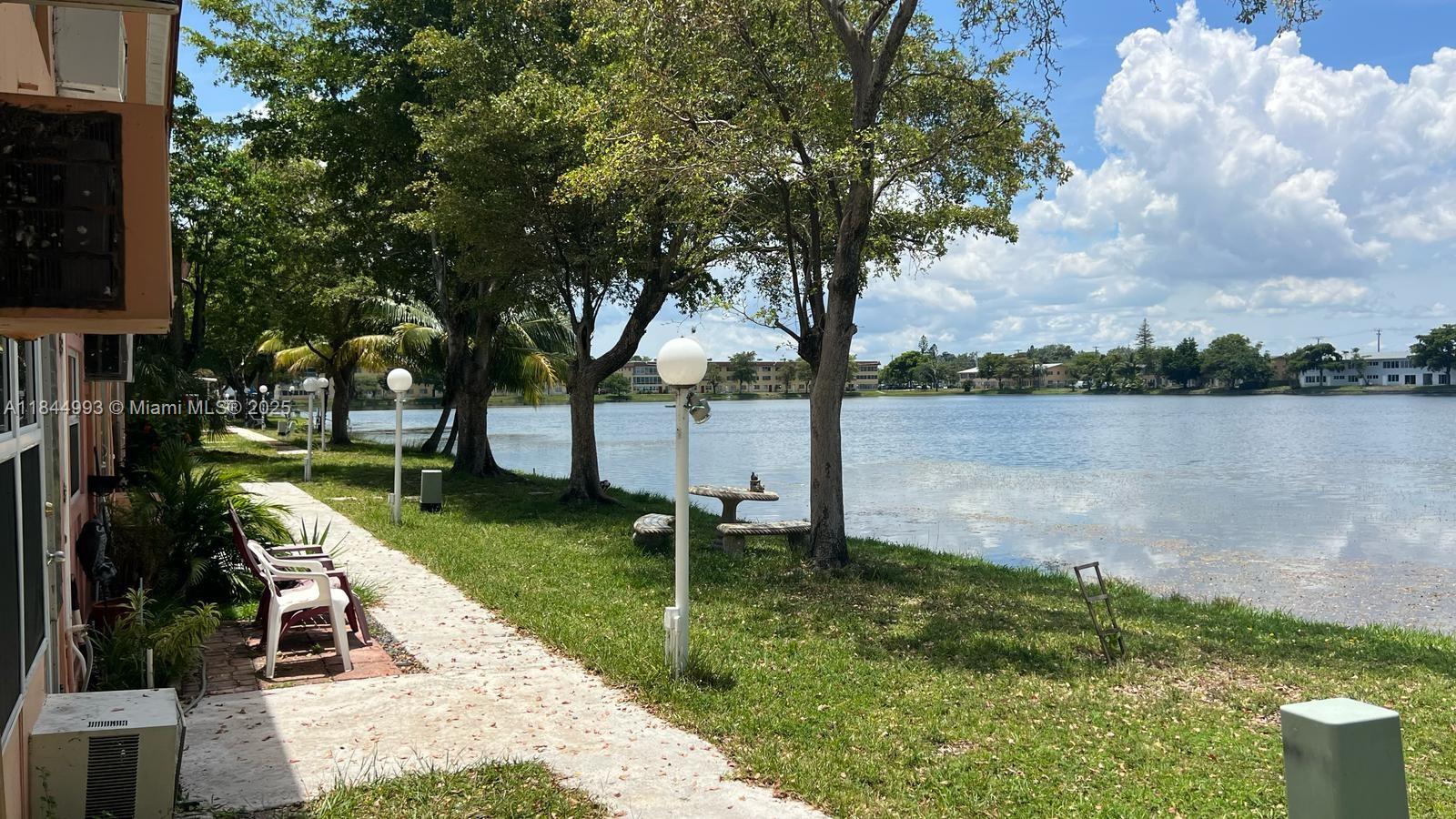 a view of a lake with a garden