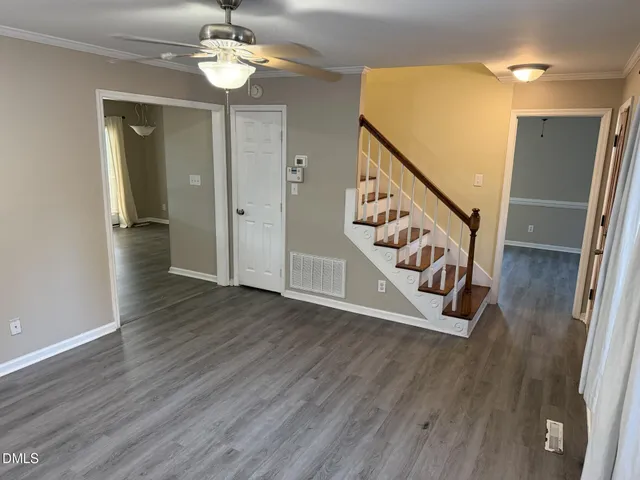 a view of an entryway with wooden floor