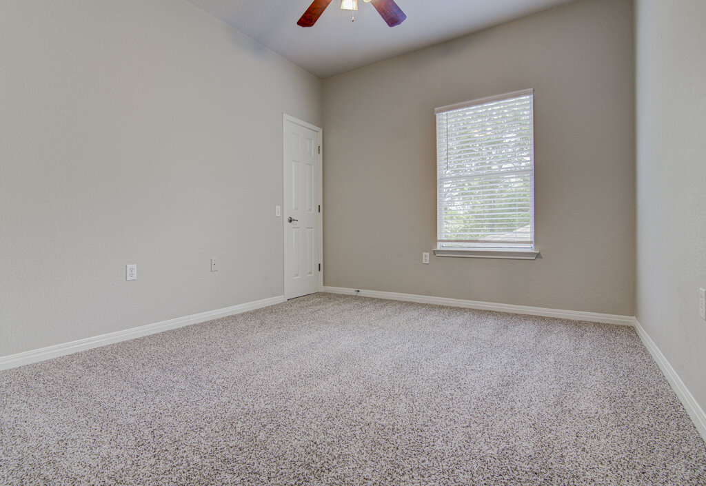 1702 Singleton Avenue, Unit A Austin, TX 78702 - Photo 14 of 27 an empty room with a window