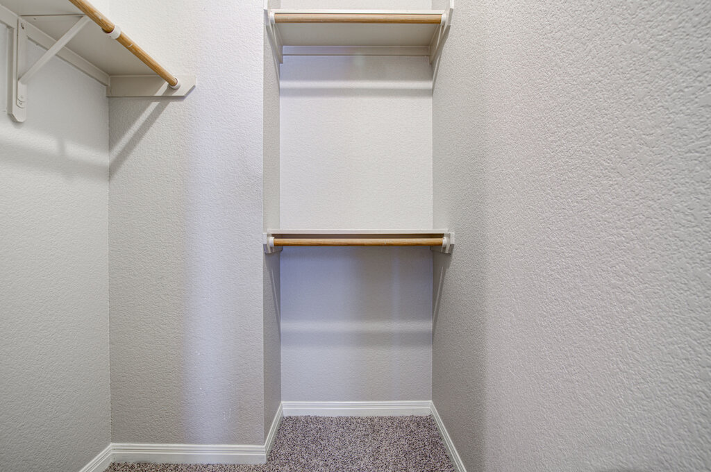 1702 Singleton Avenue, Unit A Austin, TX 78702 - Photo 15 of 27 a view of walk in closet with empty racks