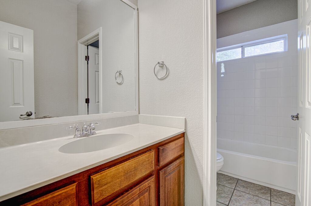 1702 Singleton Avenue, Unit A Austin, TX 78702 - Photo 18 of 27 a bathroom with a sink and a bathtub