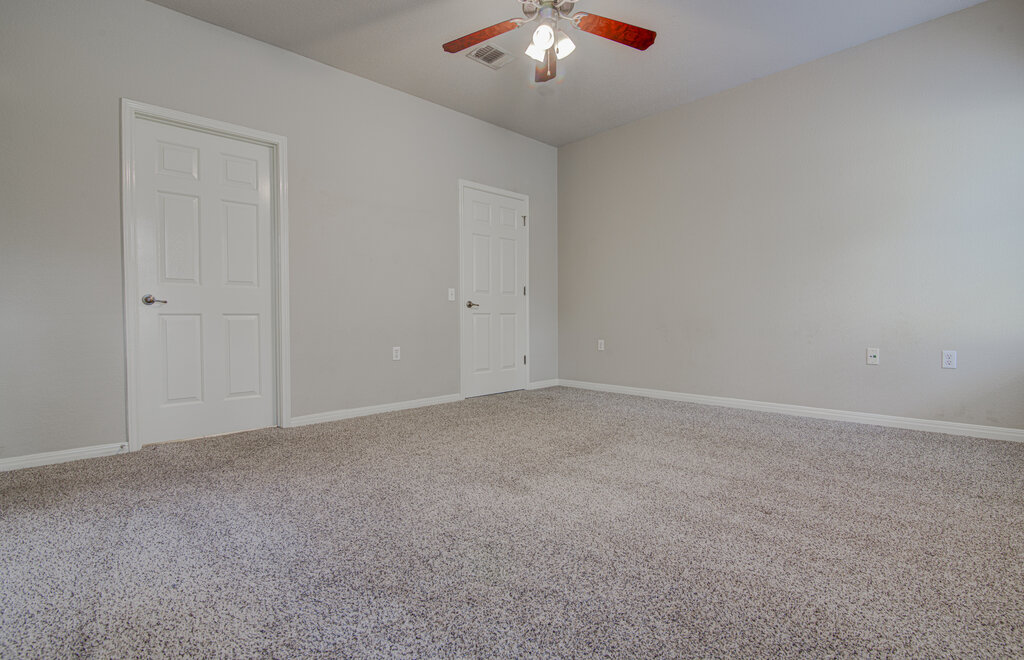 1702 Singleton Avenue, Unit A Austin, TX 78702 - Photo 22 of 27 a view of an empty room with a chandelier fan