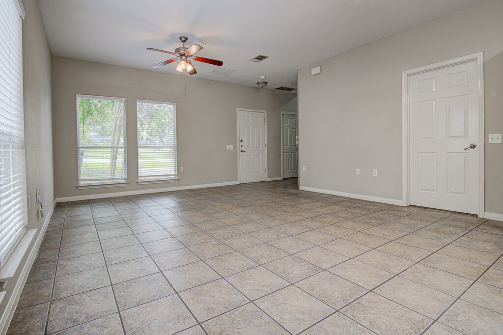 1702 Singleton Avenue, Unit A Austin, TX 78702 - Photo 4 of 27 a view of an empty room with a window