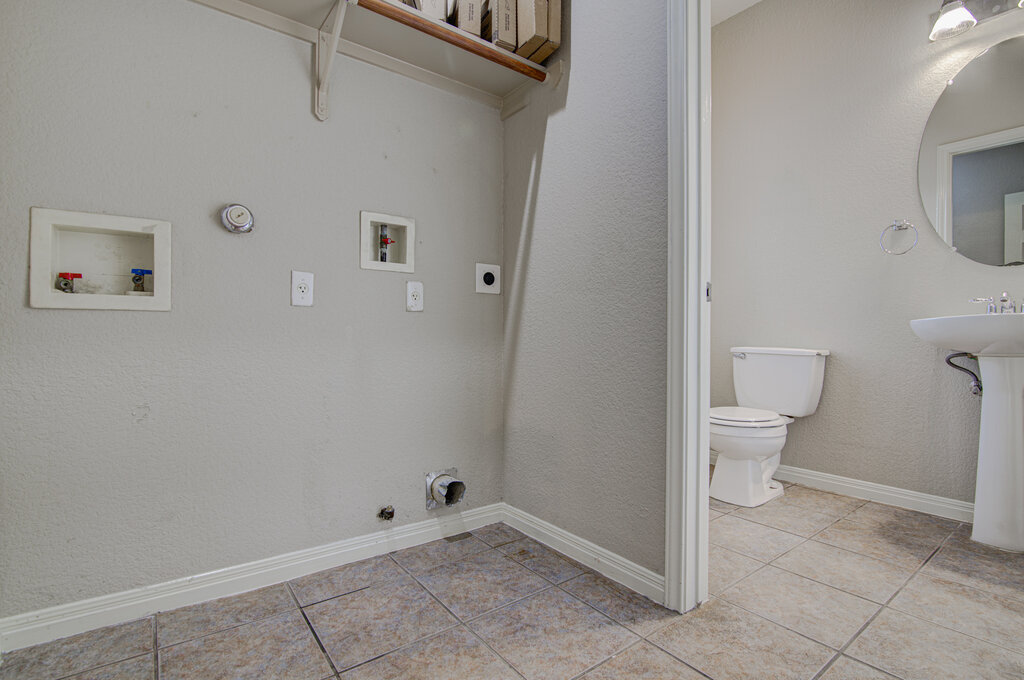 1702 Singleton Avenue, Unit A Austin, TX 78702 - Photo 9 of 27 a bathroom with a toilet and a shower