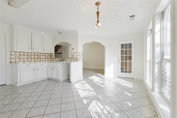 a view of a kitchen with a sink dishwasher and cabinets