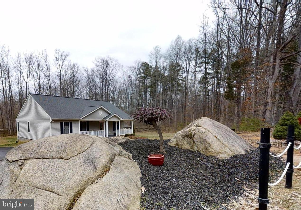 839 Daniel Road Louisa, VA 23093 - Photo 2 of 31 a view of a house with a yard and tree s