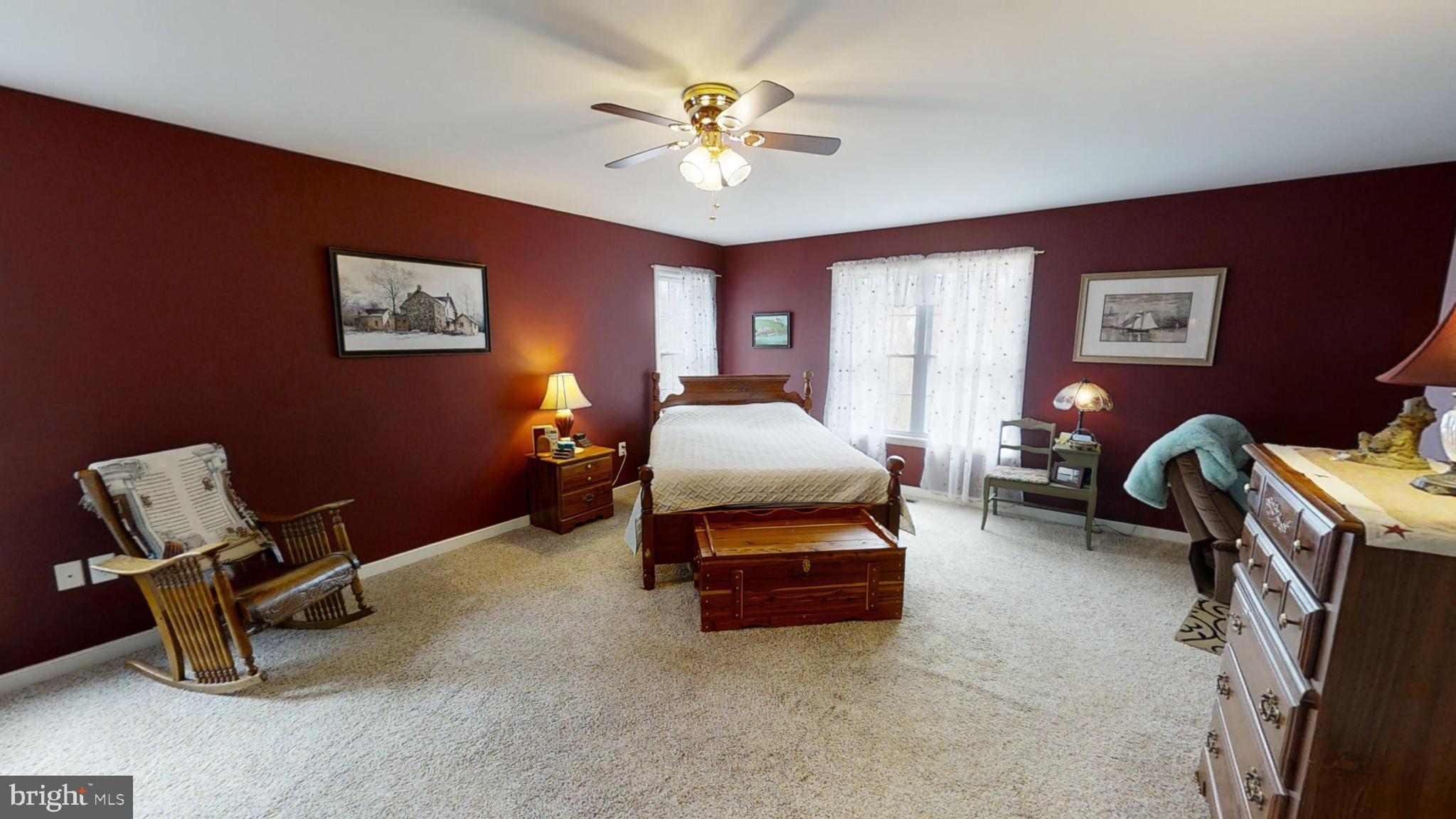839 Daniel Road Louisa, VA 23093 - Photo 9 of 31 a bedroom with furniture and a ceiling fan