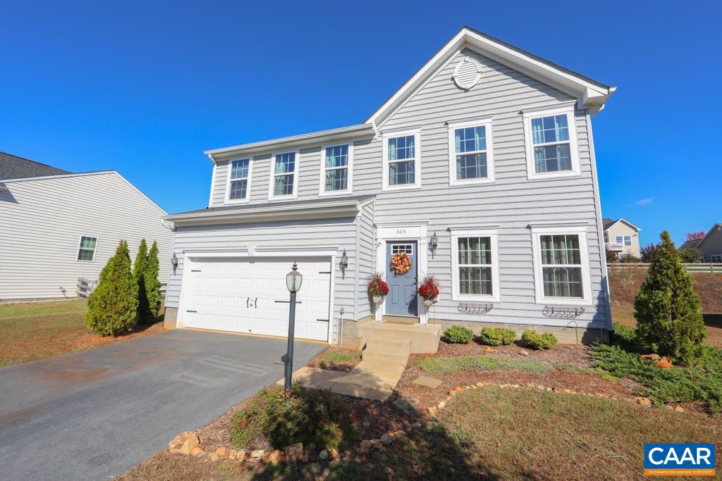 309 Ridgemont Road Ruckersville, VA 22968 - Photo 1 of 29 a front view of a house with a yard and potted plants