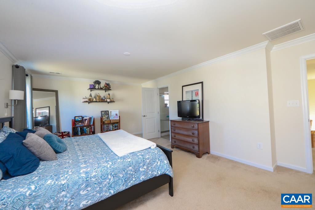 309 Ridgemont Road Ruckersville, VA 22968 - Photo 15 of 29 a bedroom with a bed and dresser