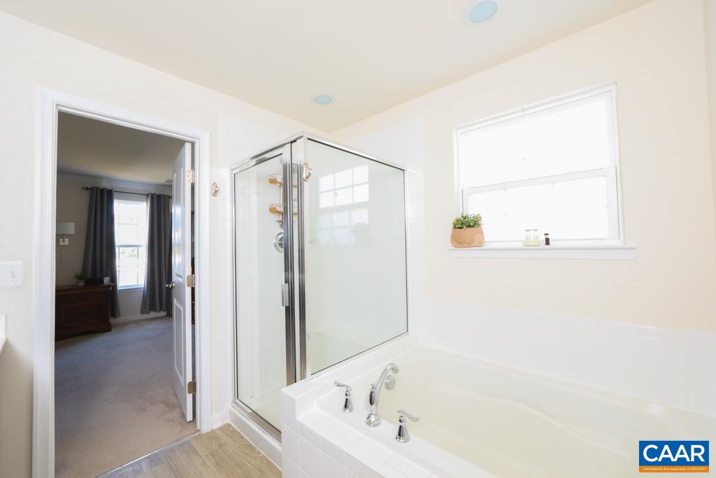 309 Ridgemont Road Ruckersville, VA 22968 - Photo 16 of 29 a bathroom with a bathtub and a shower