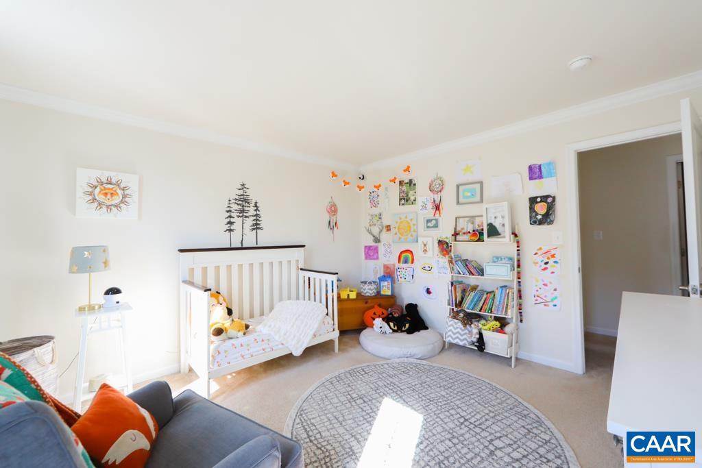 309 Ridgemont Road Ruckersville, VA 22968 - Photo 22 of 29 a bedroom with baby toys and a couch