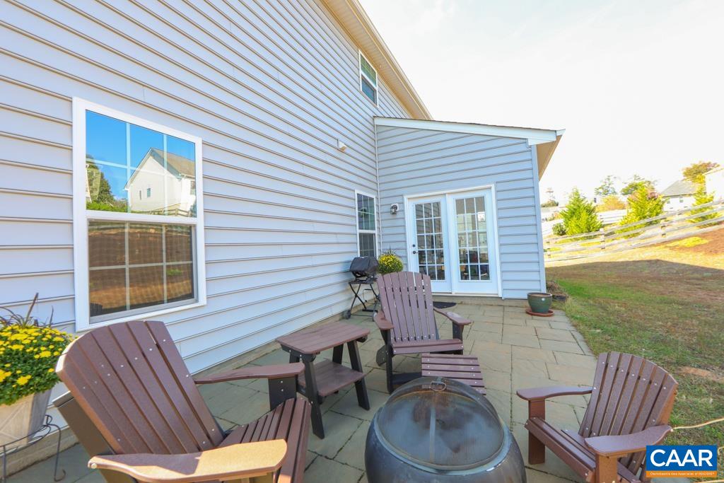 309 Ridgemont Road Ruckersville, VA 22968 - Photo 24 of 29 a view of a patio with table and chairs and potted plants