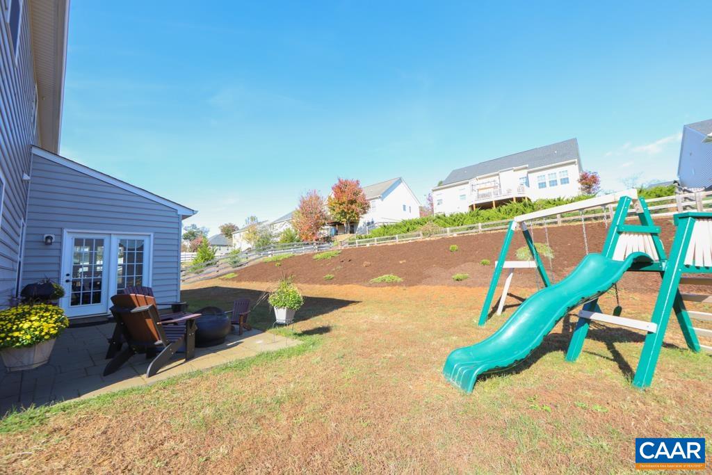 309 Ridgemont Road Ruckersville, VA 22968 - Photo 25 of 29 a view of a patio with a table and chairs