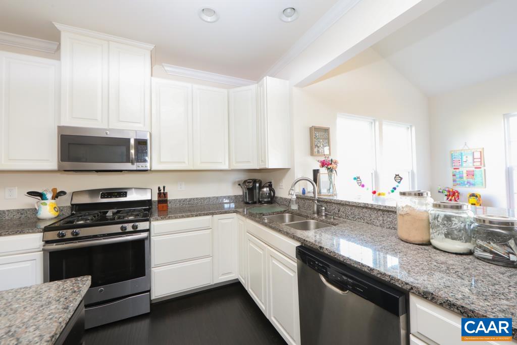 309 Ridgemont Road Ruckersville, VA 22968 - Photo 5 of 29 a kitchen with a sink stove top oven and microwave