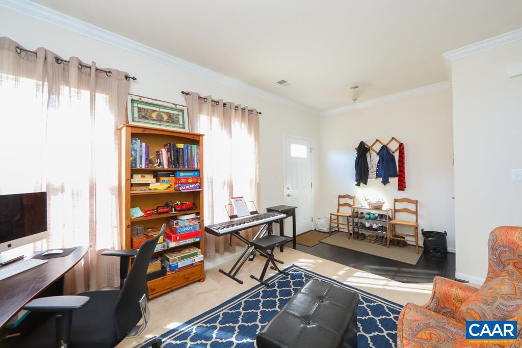 309 Ridgemont Road Ruckersville, VA 22968 - Photo 7 of 29 a living room with furniture a flat screen tv and a window