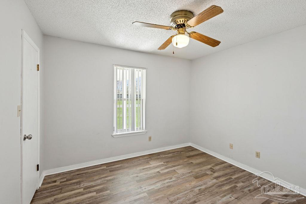 2329 Ryale Road Cantonment, FL 32533 - Photo 13 of 31 an empty room with a window and a fan