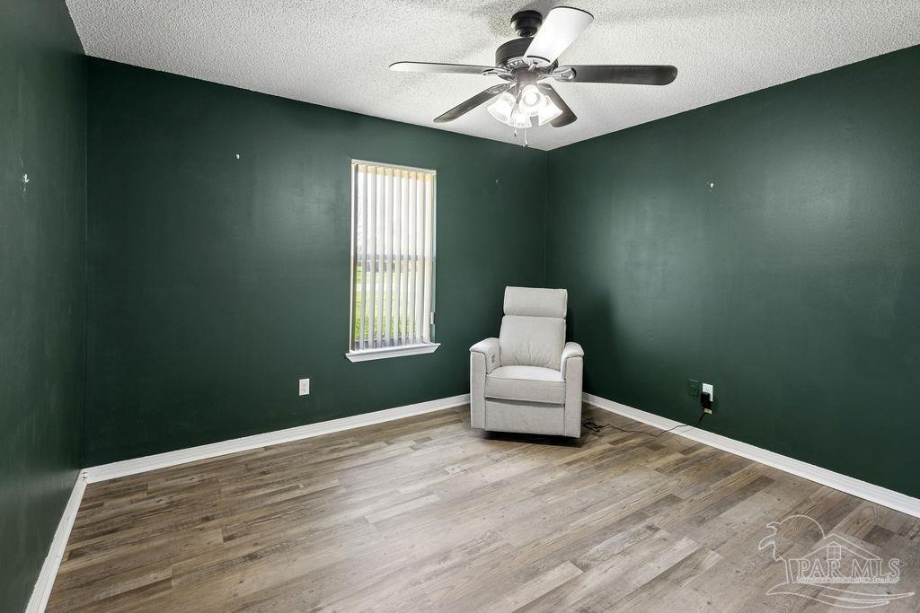 2329 Ryale Road Cantonment, FL 32533 - Photo 17 of 31 a bedroom with a bed and a window