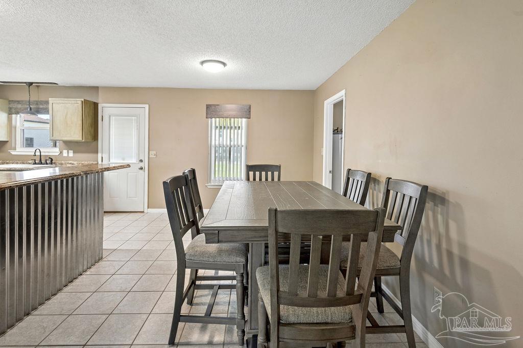 2329 Ryale Road Cantonment, FL 32533 - Photo 20 of 31 a view of a dining room with furniture