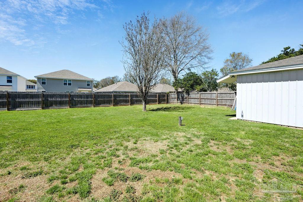 2329 Ryale Road Cantonment, FL 32533 - Photo 28 of 31 a view of a house with a big yard and large trees