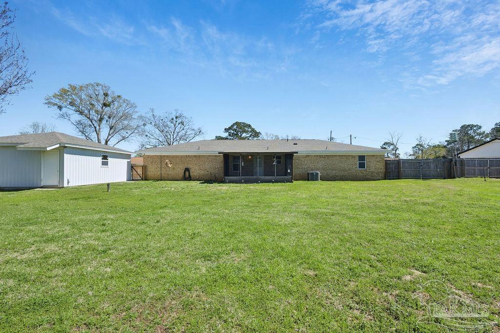 2329 Ryale Road Cantonment, FL 32533 - Photo 29 of 31 a front view of house with a garden