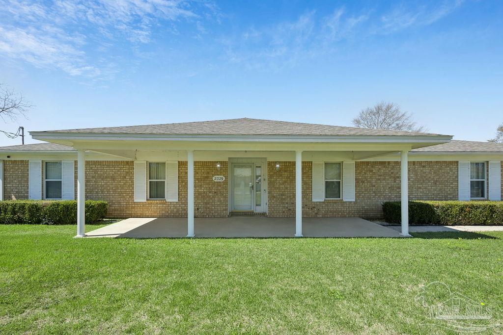 2329 Ryale Road Cantonment, FL 32533 - Photo 30 of 31 front view of a house with a yard