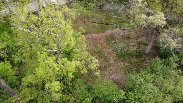 a view of a house with a yard covered in snow