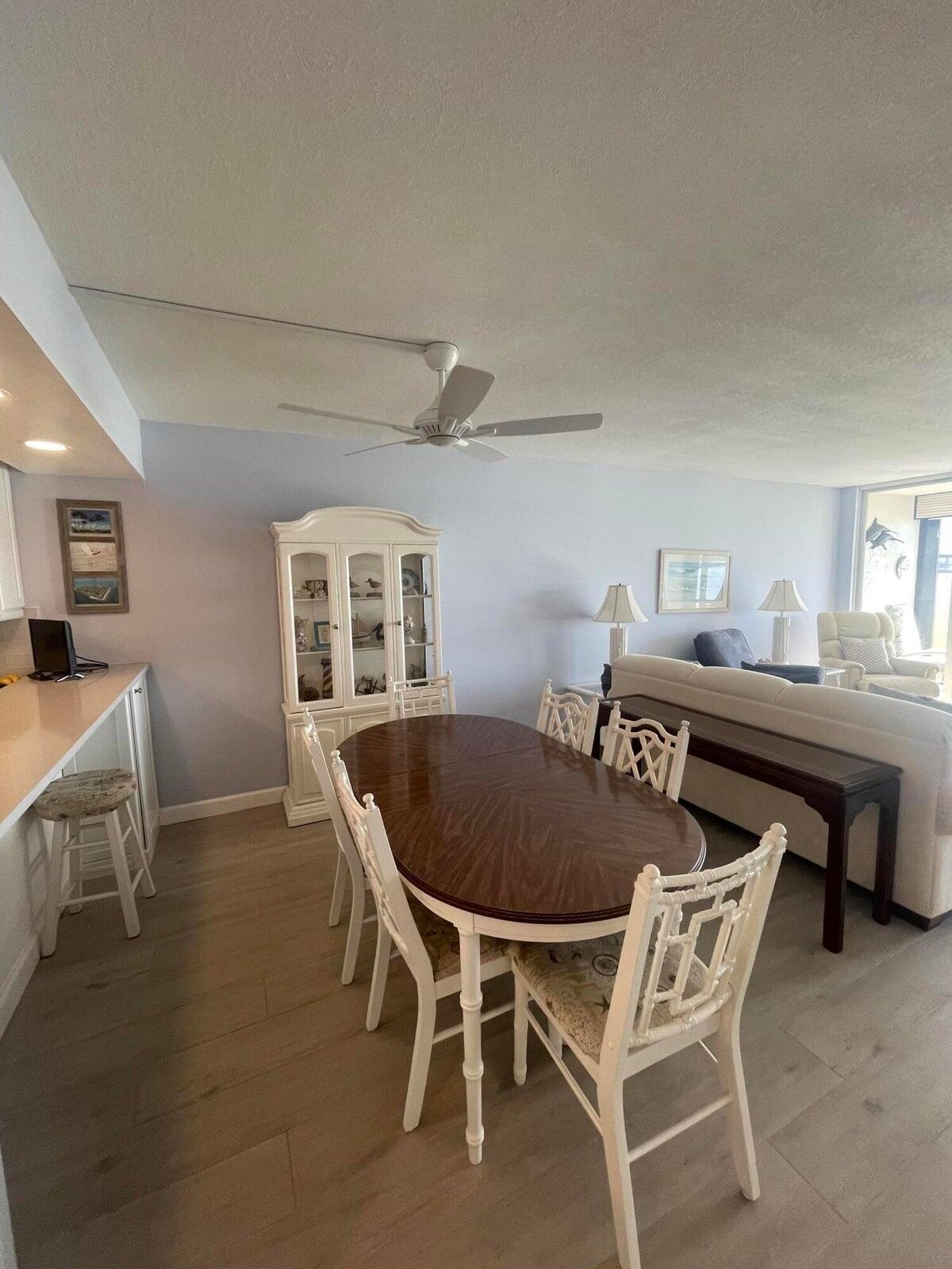 1950 Southwest Palm City Road, Unit 13104 Stuart, FL 34994 - Photo 4 of 12 a dining room with furniture and window