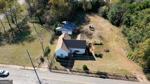 an aerial view of house with yard