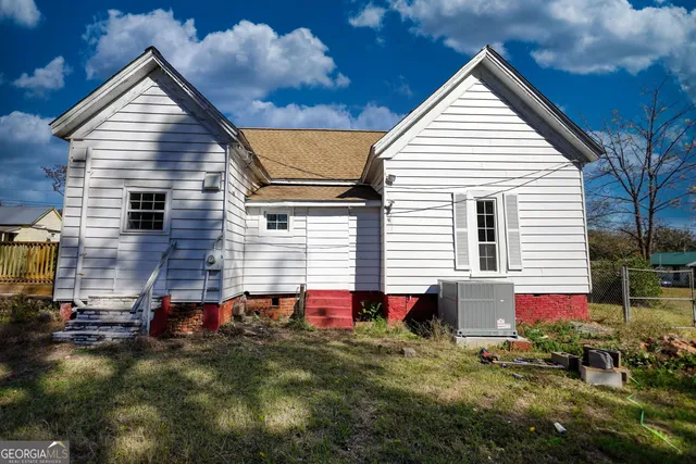 a backyard of a house with yard and garage