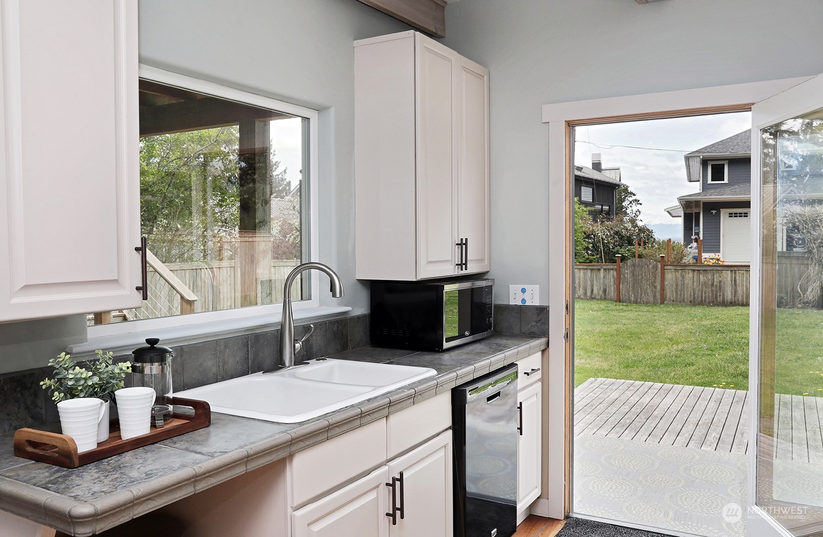 5880 Mutiny Bay Road Freeland, WA 98249 - Photo 20 of 40 a kitchen with a sink cabinets and window
