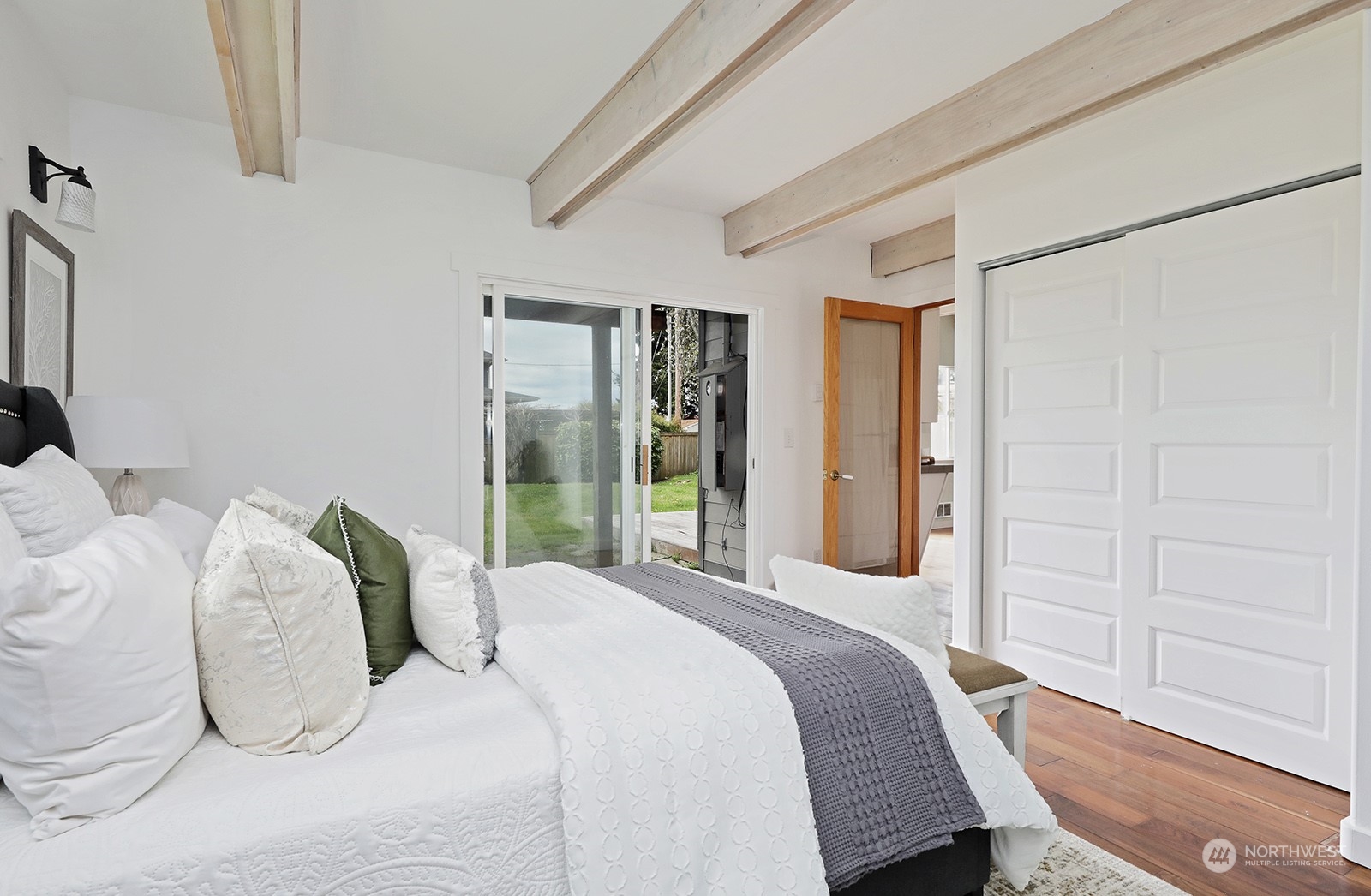 5880 Mutiny Bay Road Freeland, WA 98249 - Photo 23 of 40 a bedroom with bed and large window